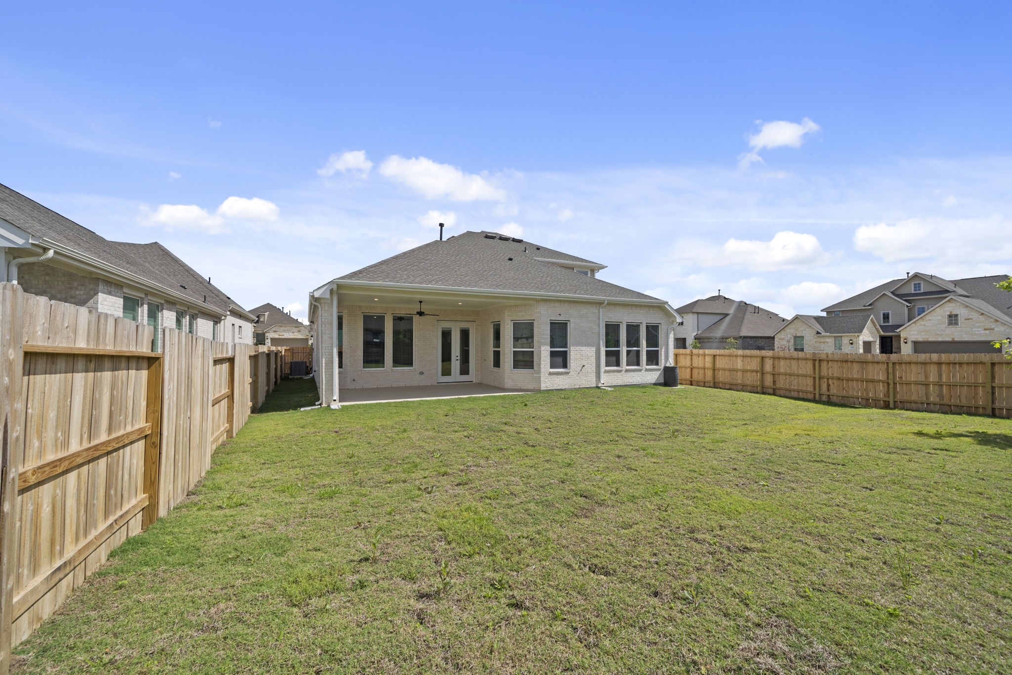 18103 Scarlett Hummingbird Court Conroe, TX 77302 - Photo 25 of 43 a view of an house with backyard and entertaining space