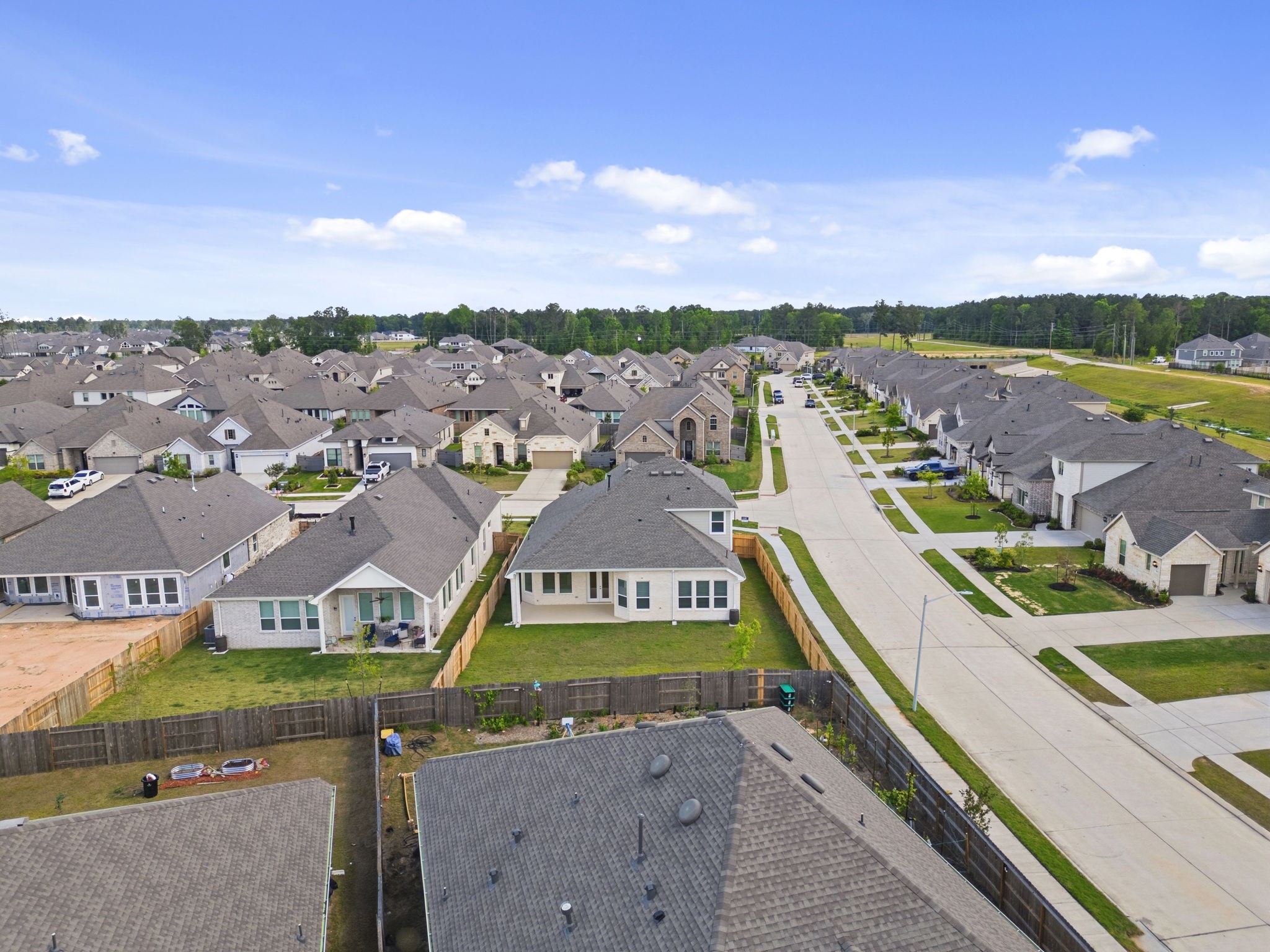 18103 Scarlett Hummingbird Court Conroe, TX 77302 - Photo 28 of 43 aerial view of a city