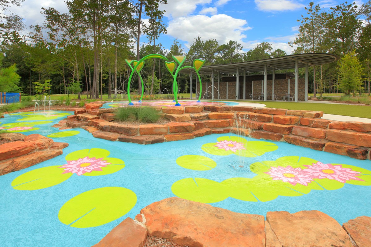18103 Scarlett Hummingbird Court Conroe, TX 77302 - Photo 34 of 43 a view of a swimming pool with a backyard and trees