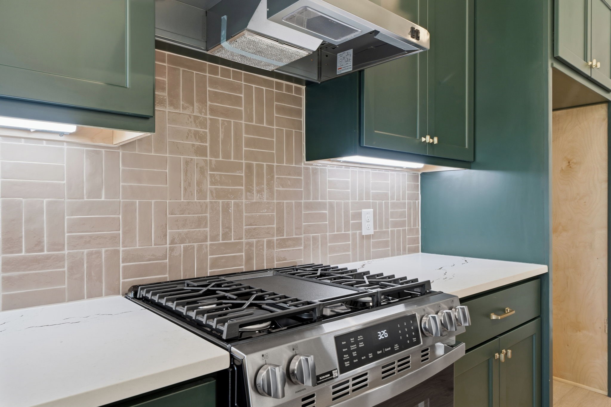 18103 Scarlett Hummingbird Court Conroe, TX 77302 - Photo 5 of 43 a stove top oven sitting inside of a kitchen
