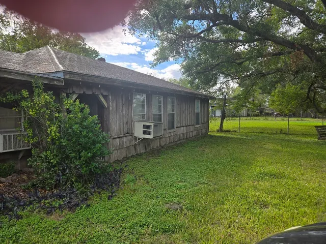 a backyard of a house with lots of green space