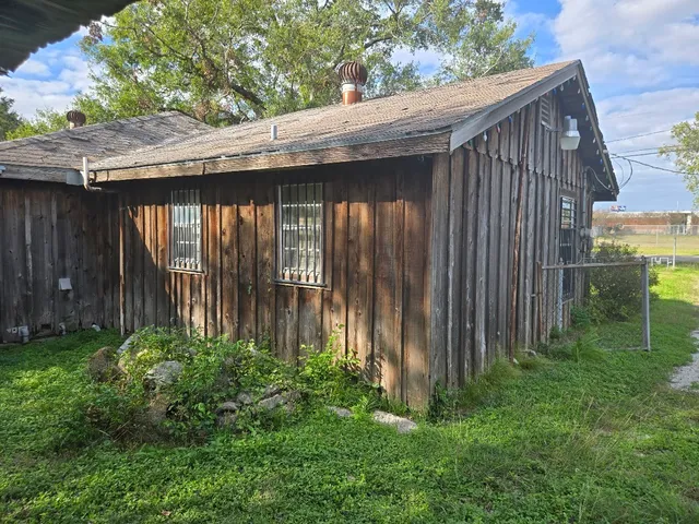 a backyard of a house with lots of green space