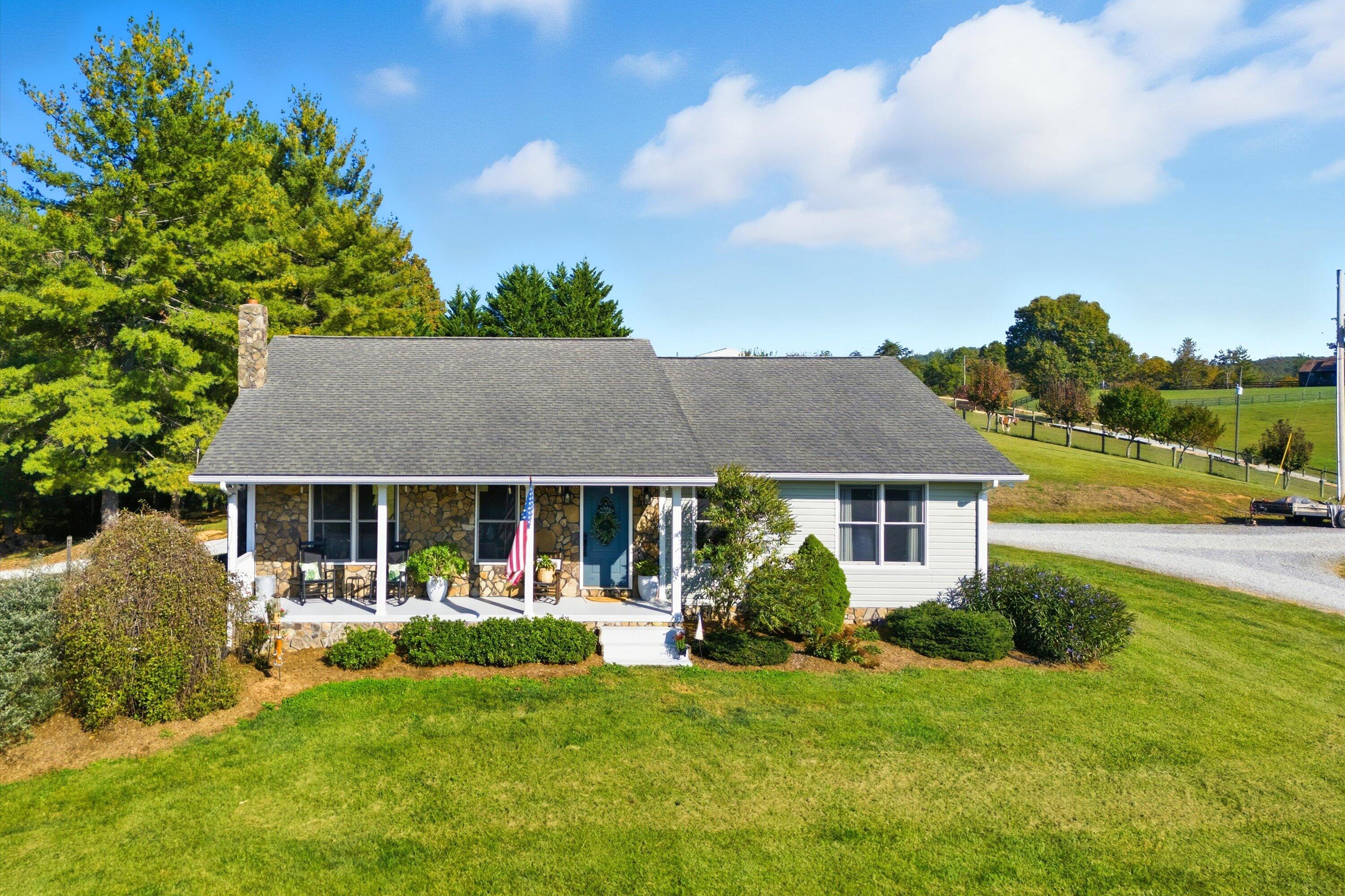 front view of a house with a yard
