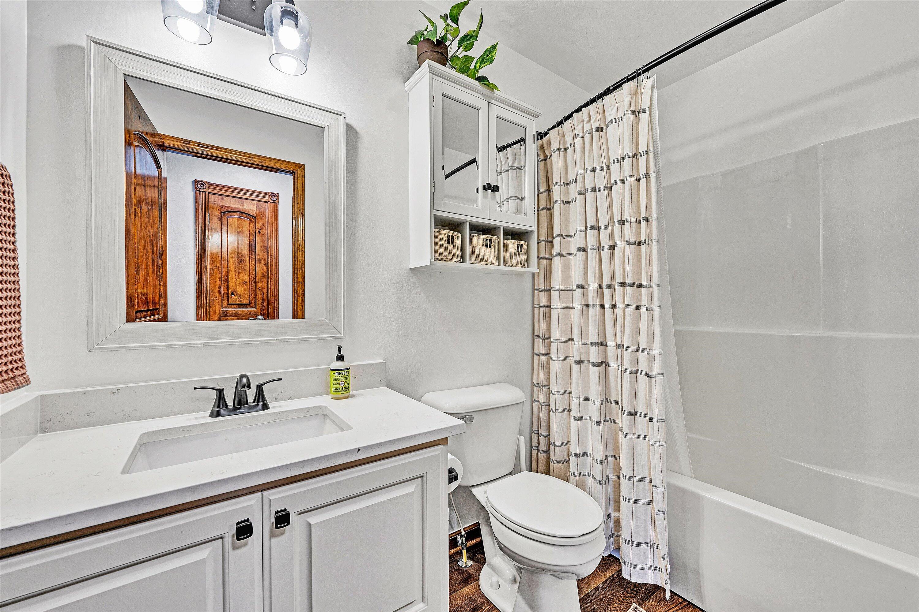 99 Spruce Lane Callaway, VA 24067 - Photo 8 of 19 a bathroom with a granite countertop sink toilet and shower