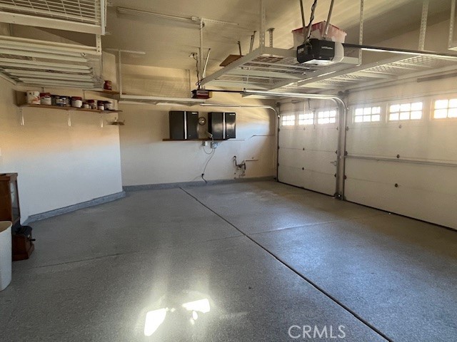 2012 Melbourne Circle Banning, CA 92220 - Photo 21 of 48 3-Car Garage has Shelving hanging from Ceiling