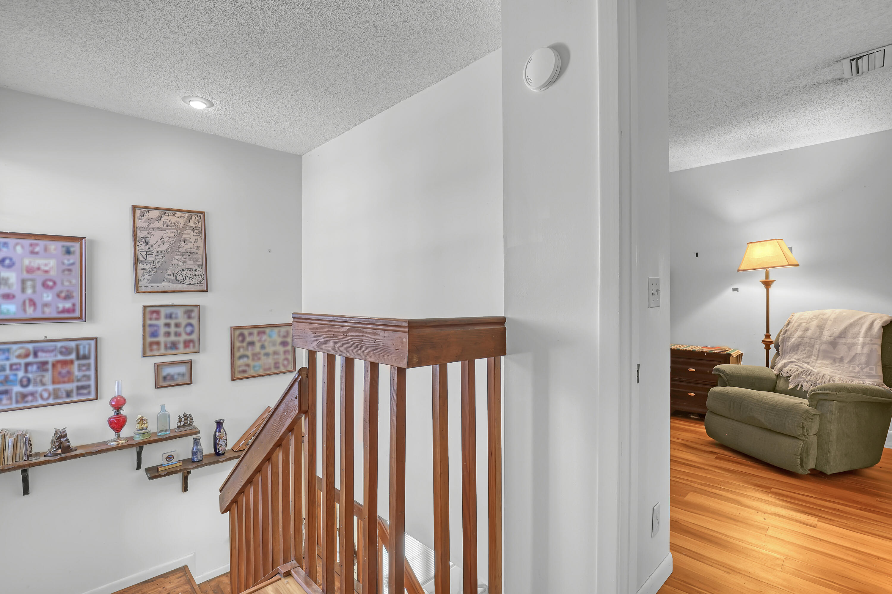 13116 Quiet Woods Road, Unit A Wellington, FL 33414 - Photo 23 of 31 a living room with furniture and a wooden floor