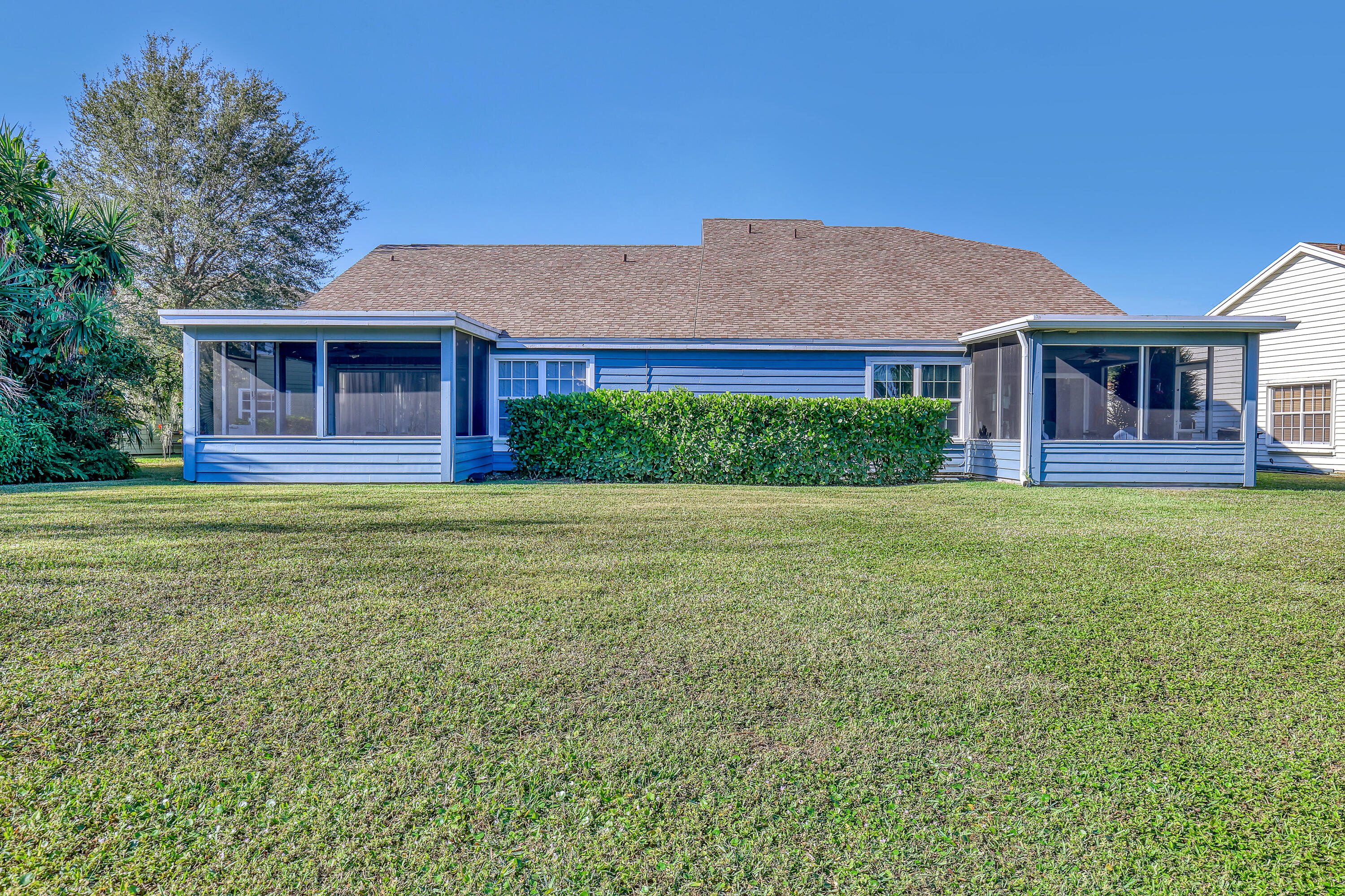 13116 Quiet Woods Road, Unit A Wellington, FL 33414 - Photo 30 of 31 a front view of a house with a yard