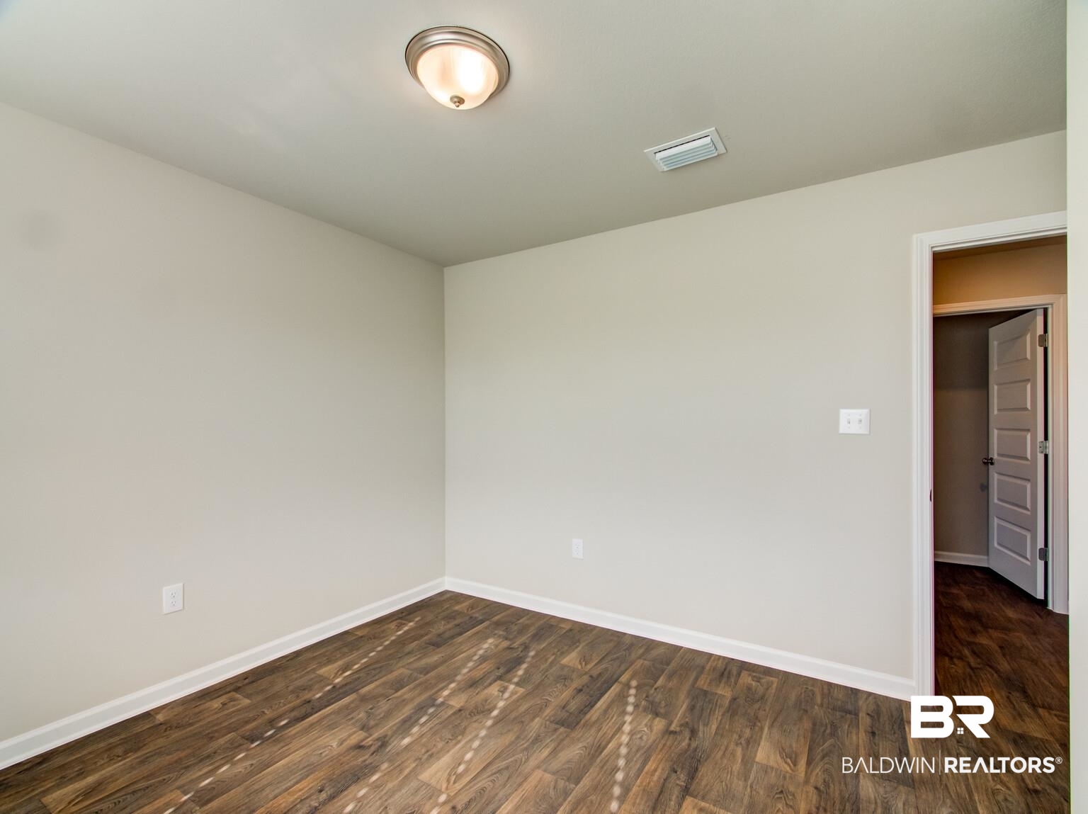 23952 Citation Loop Daphne, AL 36526 - Photo 32 of 69 Spare room with dark wood-type flooring and baseboards