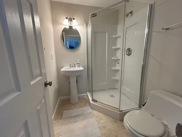 a bathroom with a toilet and a sink