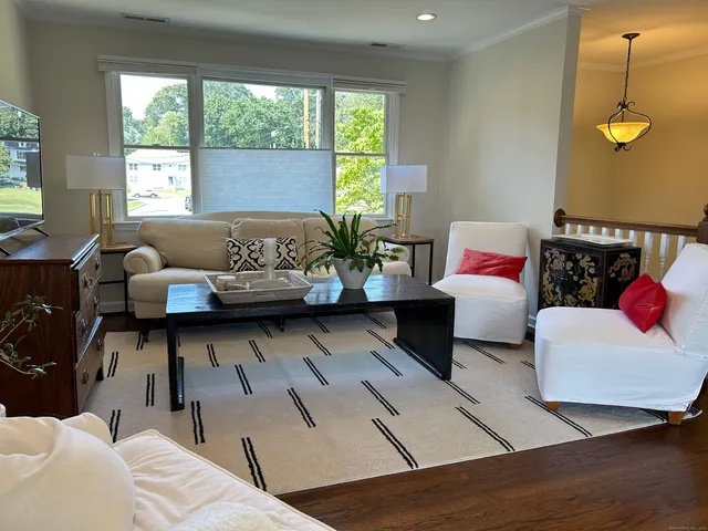 a living room with furniture and window