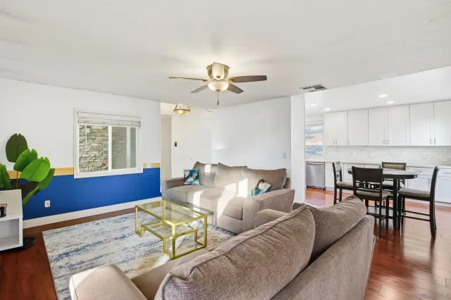 a living room with furniture and a large window