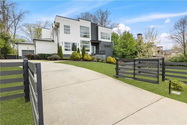 a backyard of a house with table and chairs