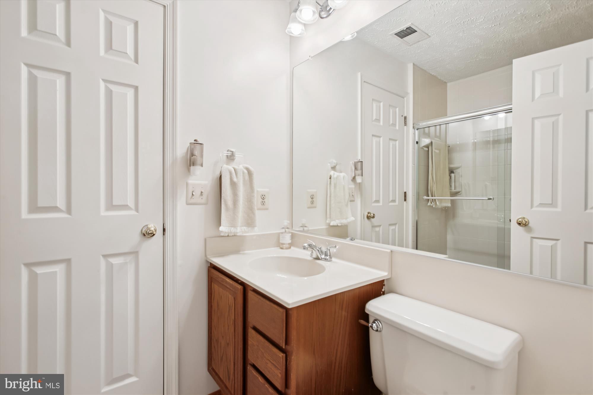 3800 Ridge Knoll Court, Unit 2 Fairfax, VA 22033 - Photo 25 of 50 a bathroom with a sink toilet and shower
