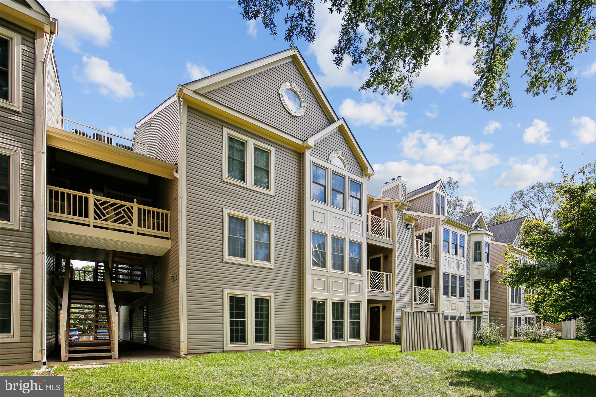 3800 Ridge Knoll Court, Unit 2 Fairfax, VA 22033 - Photo 31 of 50 a front view of a residential apartment building with a yard