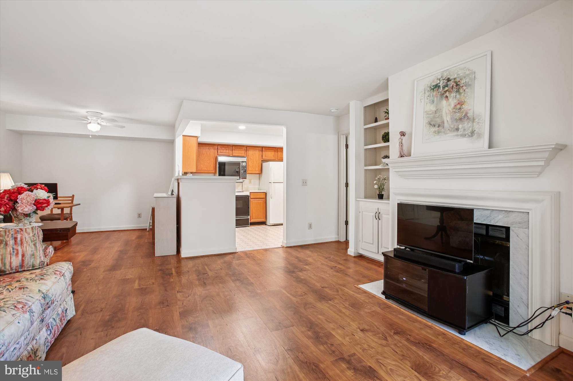 3800 Ridge Knoll Court, Unit 2 Fairfax, VA 22033 - Photo 4 of 50 a living room with furniture and a fireplace