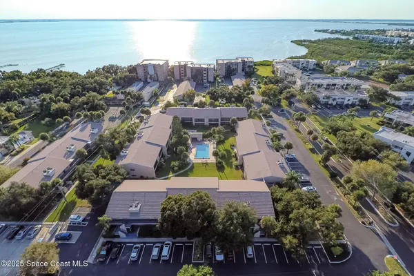 an aerial view of house with yard