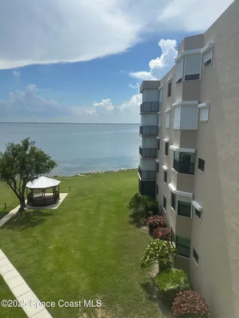 a view of a lake with a building in the background