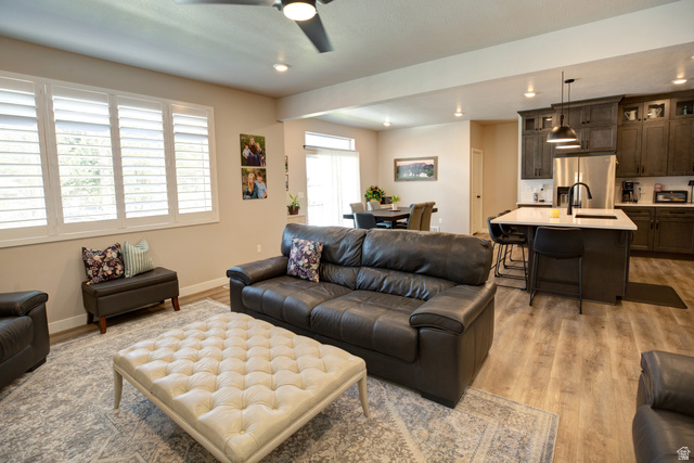 983 South 950 West Provo, UT 84601 - Photo 7 of 56 Living area with wood-finish flooring, recessed lighting, and a ceiling fan