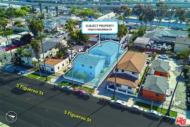 an aerial view of residential houses and street