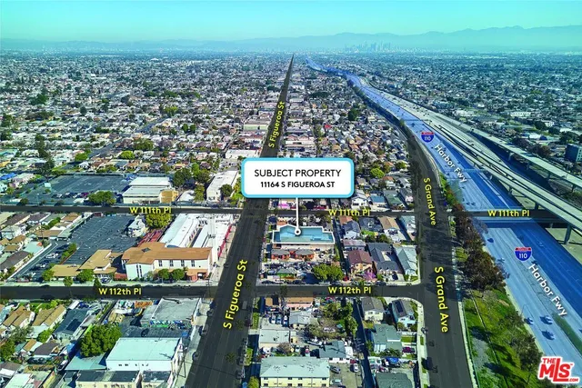 a view of a cars parked in front of a building