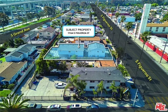 a kitchen with stainless steel appliances granite countertop a stove a sink and white cabinets