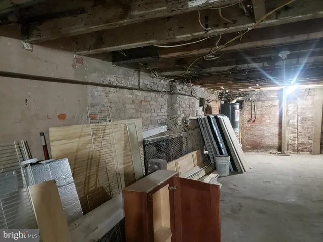 a room with water heater and storage