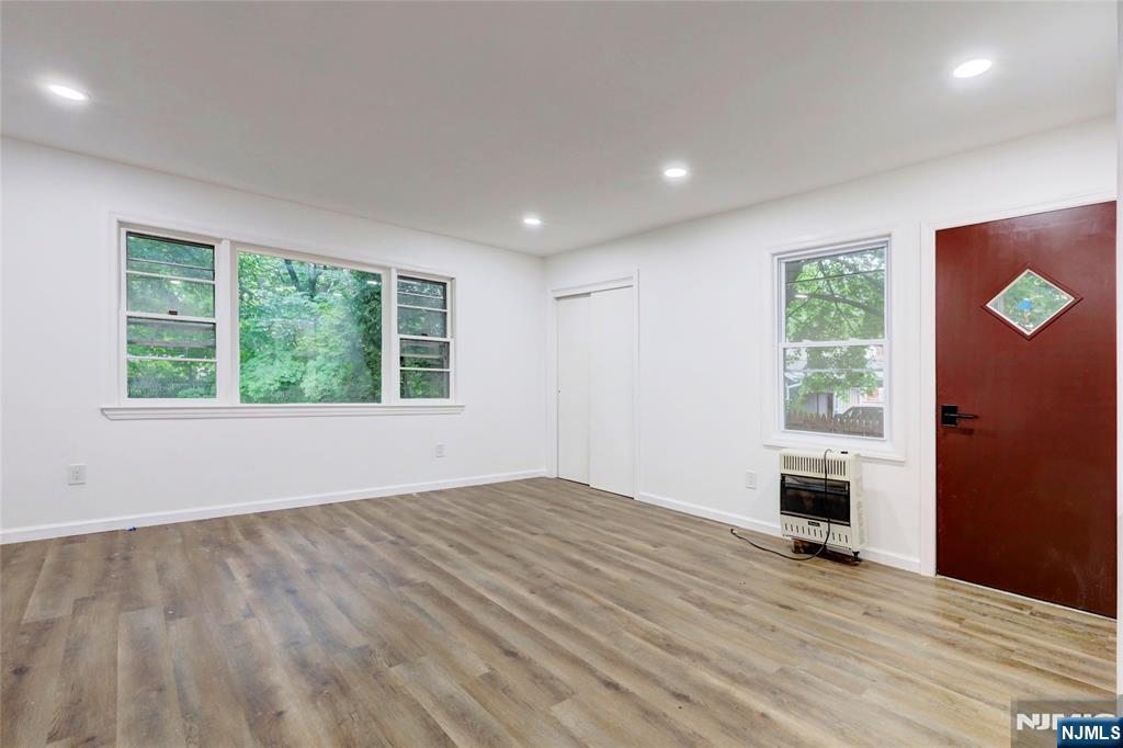 4-21 Saddle River Road, Unit 1 Fair Lawn, NJ 07410 - Photo 14 of 19 wooden floor in an empty room with a window