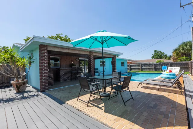 a chair and tables in the patio