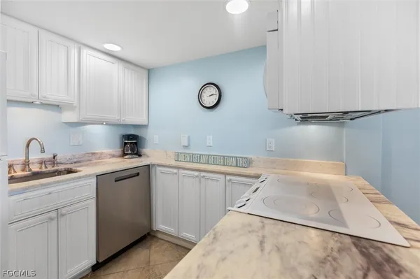 a kitchen with cabinets and sink