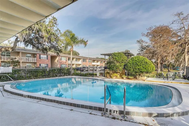 a view of outdoor space yard swimming pool and outdoor seating