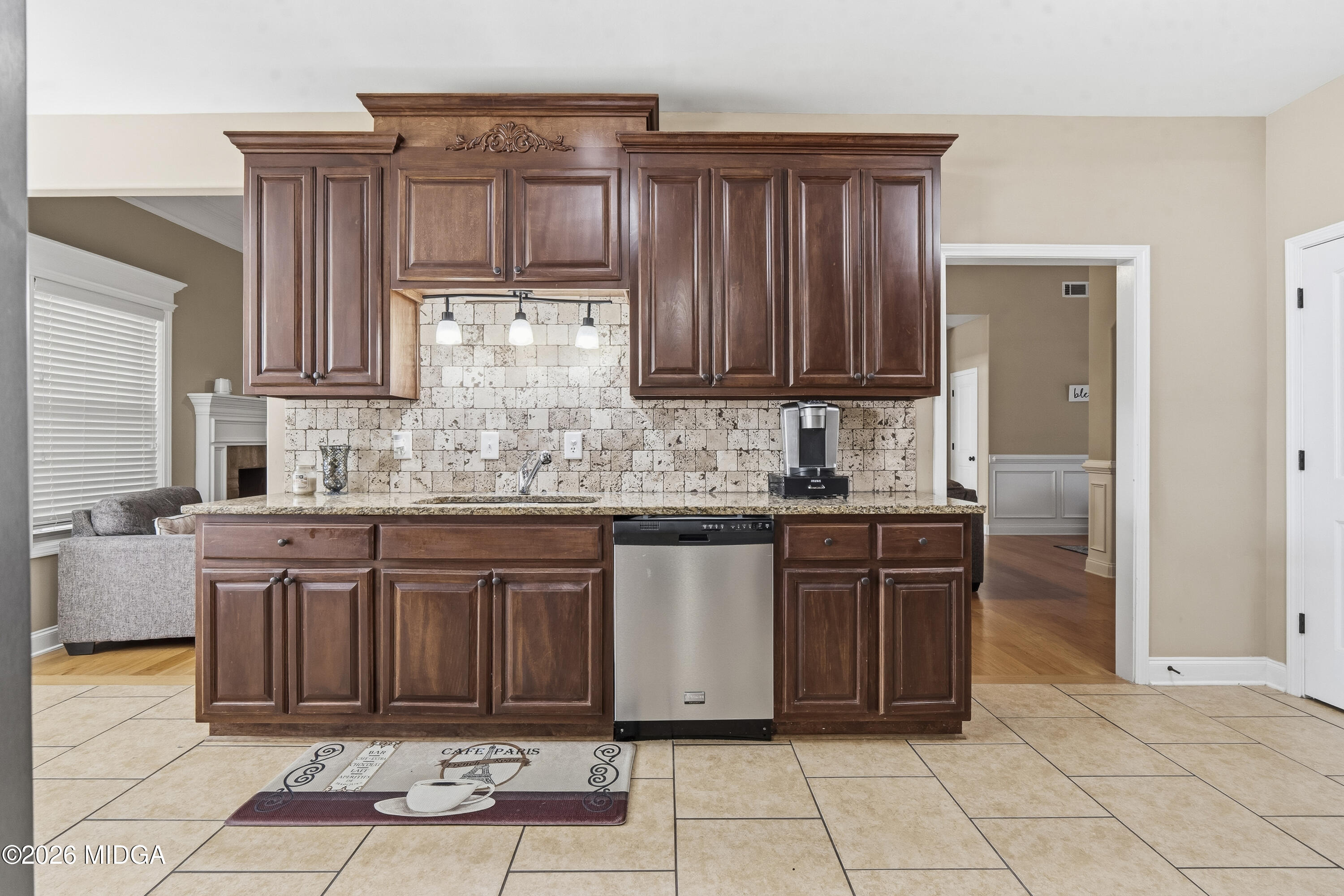 405 Stonecrest Court Macon, GA 31216 - Photo 17 of 45 a kitchen with granite countertop a refrigerator and a sink