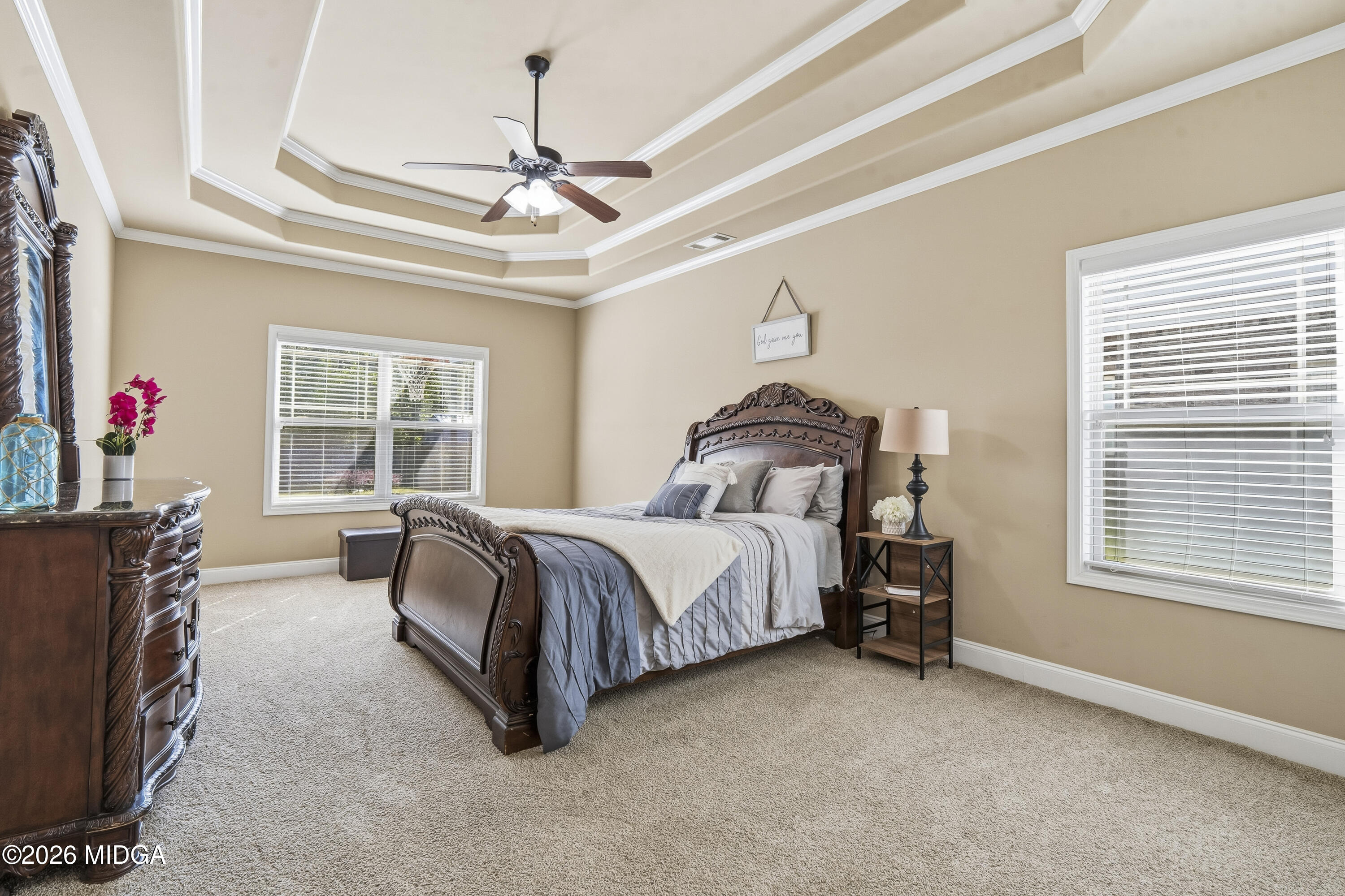 405 Stonecrest Court Macon, GA 31216 - Photo 23 of 45 a spacious bedroom with a bed and a window