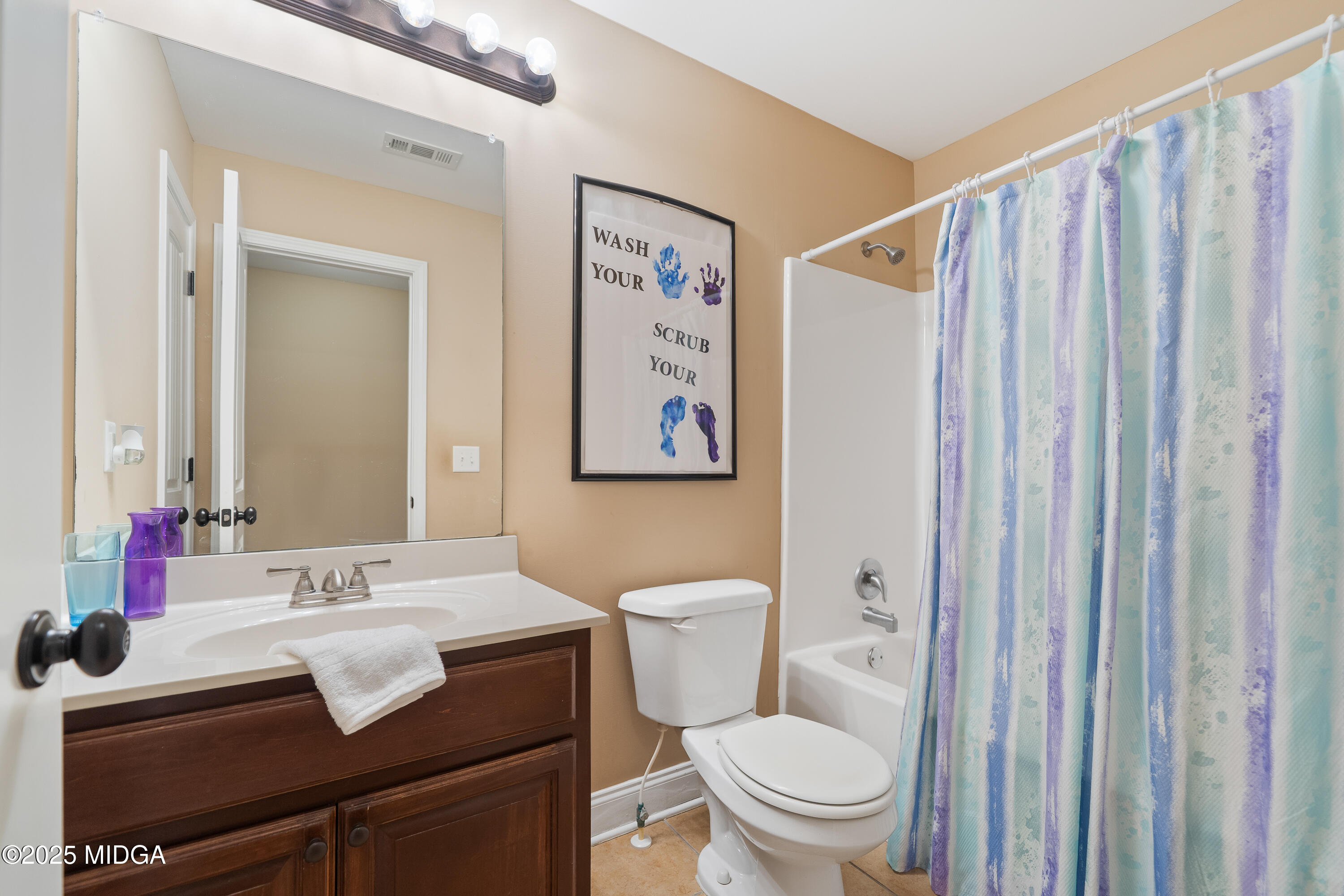 405 Stonecrest Court Macon, GA 31216 - Photo 39 of 45 a bathroom with a sink toilet and a mirror