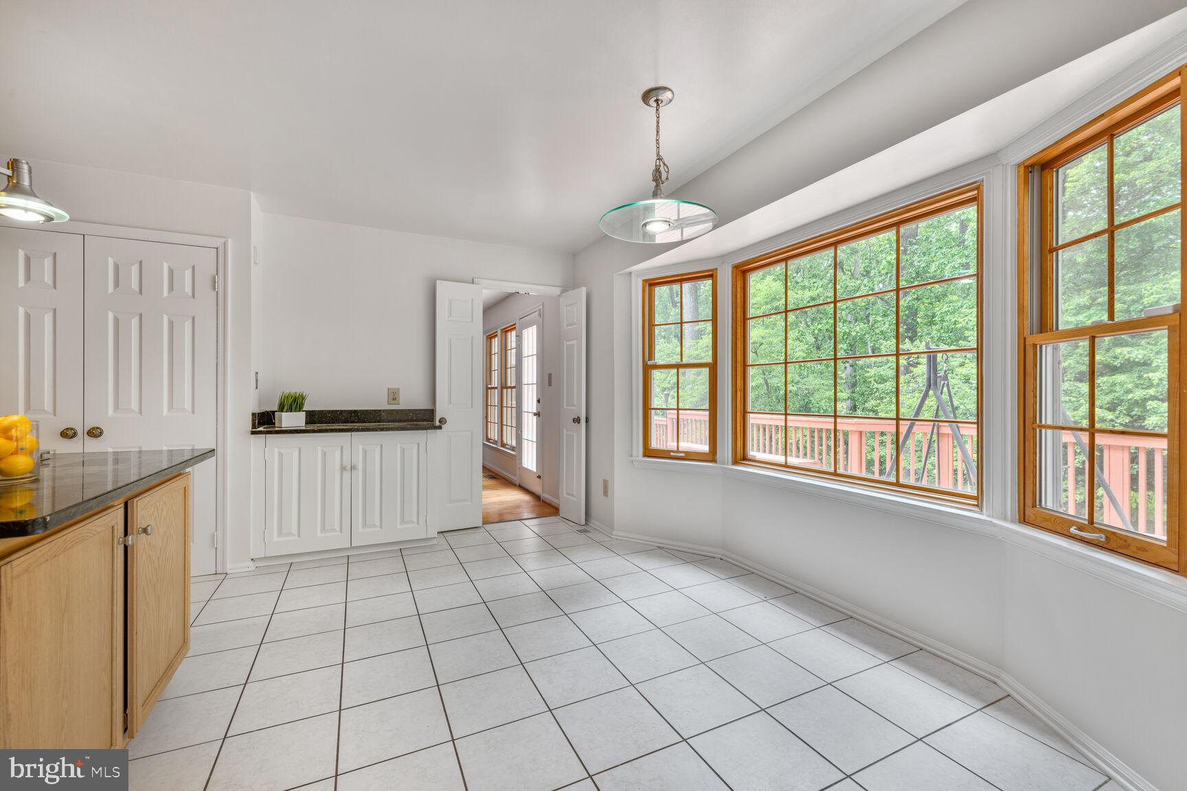 9605 Reach Road Potomac, MD 20854 - Photo 12 of 44 a view of an empty room with a window
