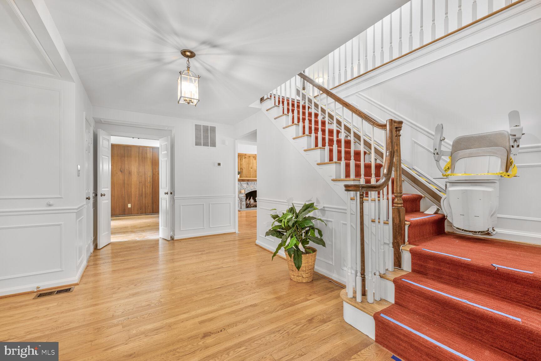 9605 Reach Road Potomac, MD 20854 - Photo 14 of 44 a view of entryway and hall with wooden floor