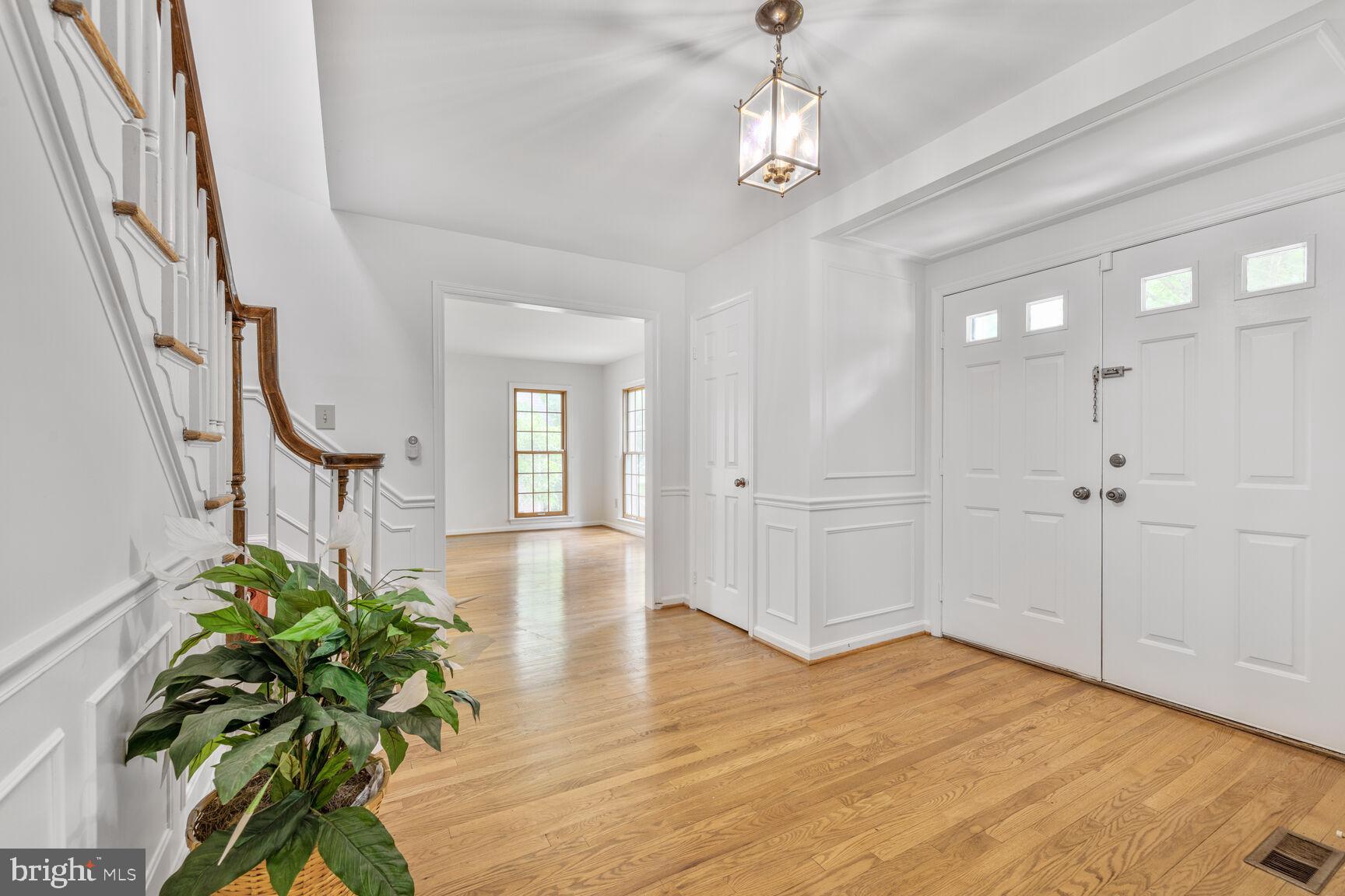9605 Reach Road Potomac, MD 20854 - Photo 15 of 44 a very nice looking hallway with wooden floor