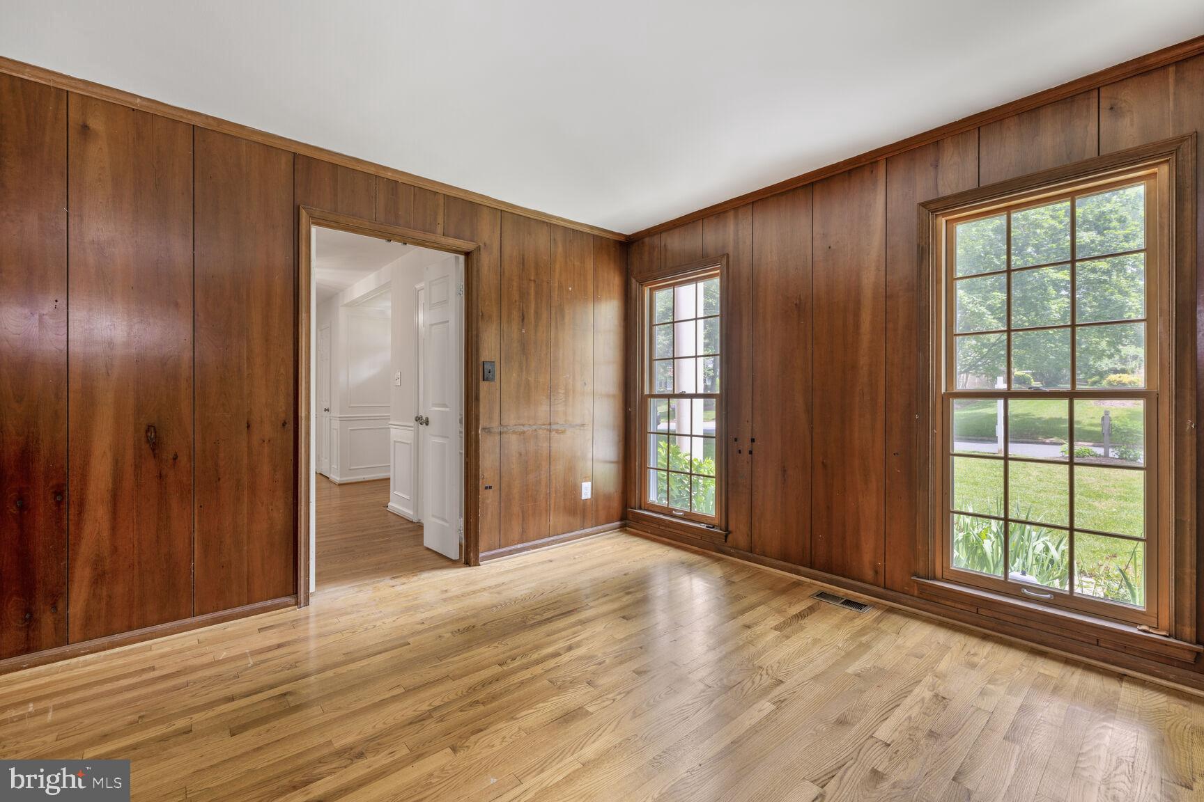 9605 Reach Road Potomac, MD 20854 - Photo 17 of 44 wooden floor and windows in an empty room