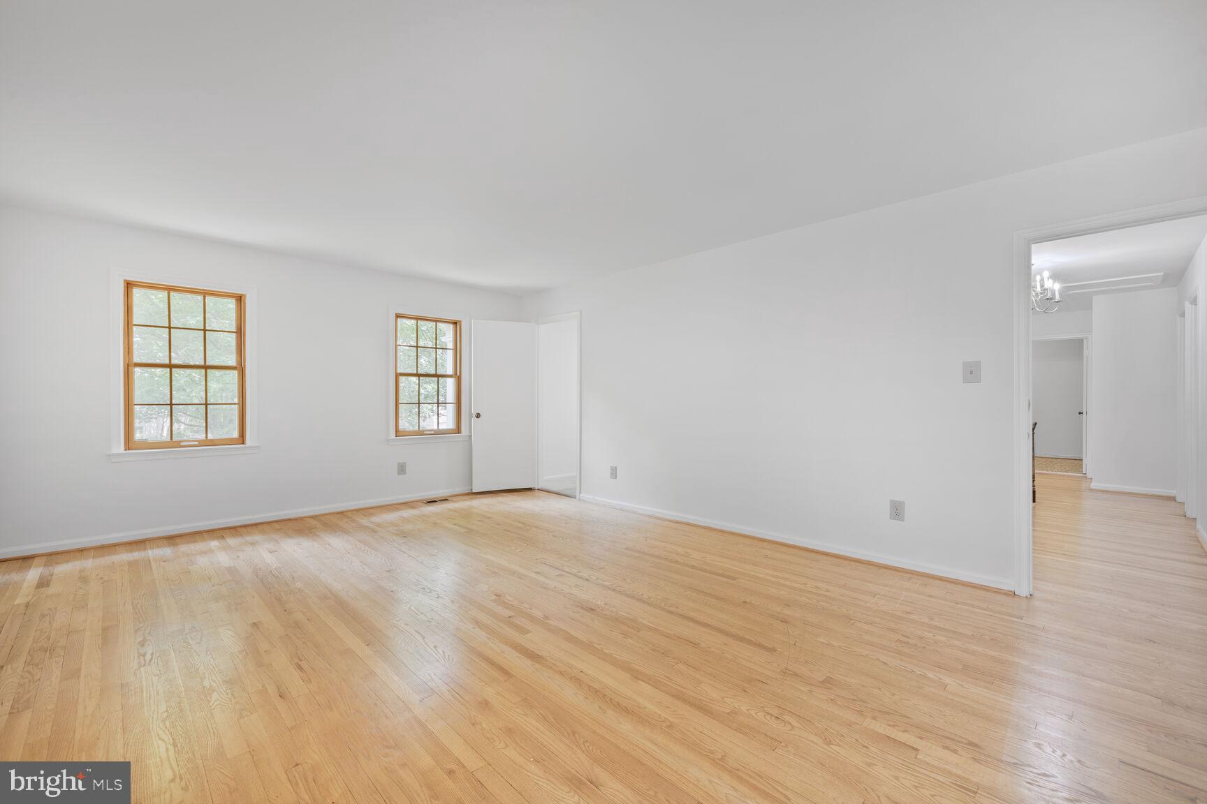 9605 Reach Road Potomac, MD 20854 - Photo 19 of 44 wooden floor in an empty room with a window