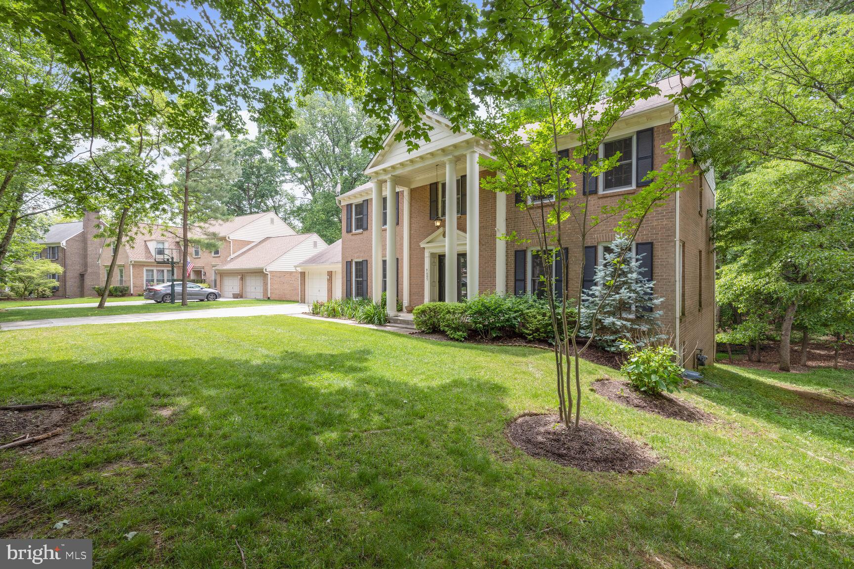 9605 Reach Road Potomac, MD 20854 - Photo 2 of 44 a front view of house with yard and green space