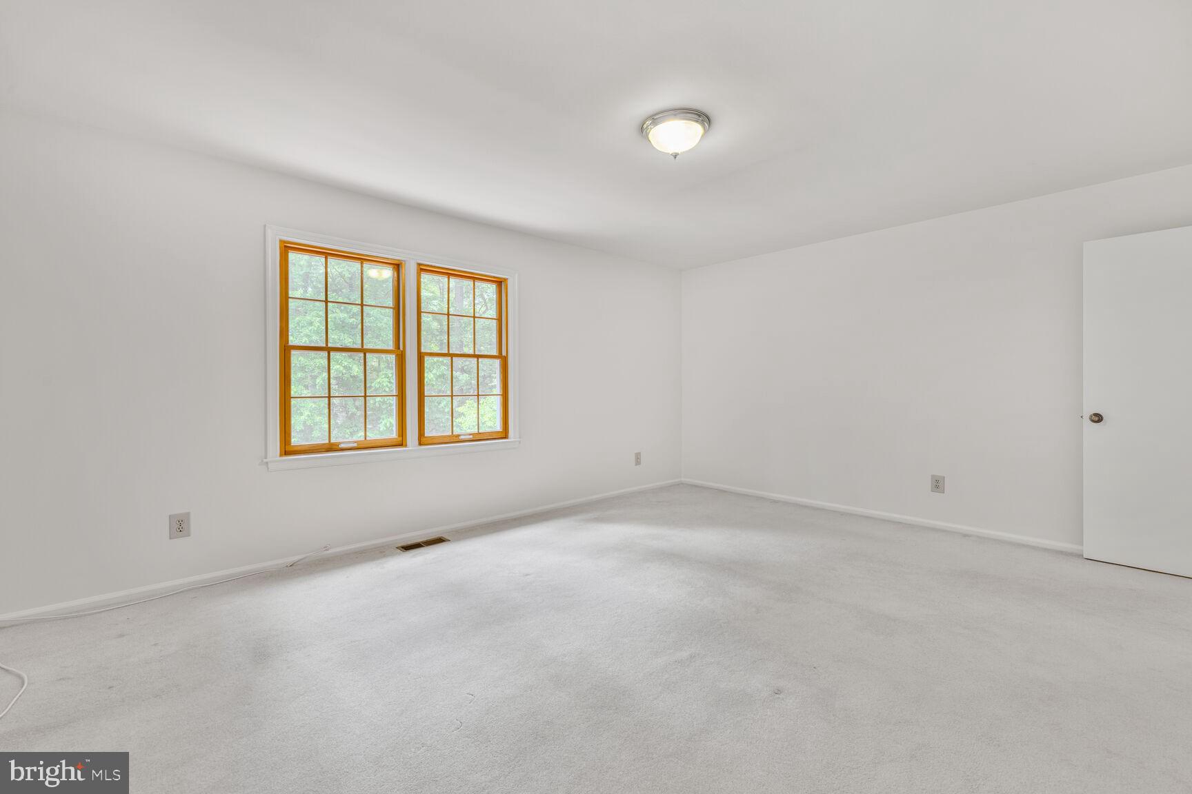 9605 Reach Road Potomac, MD 20854 - Photo 21 of 44 an empty room with a window