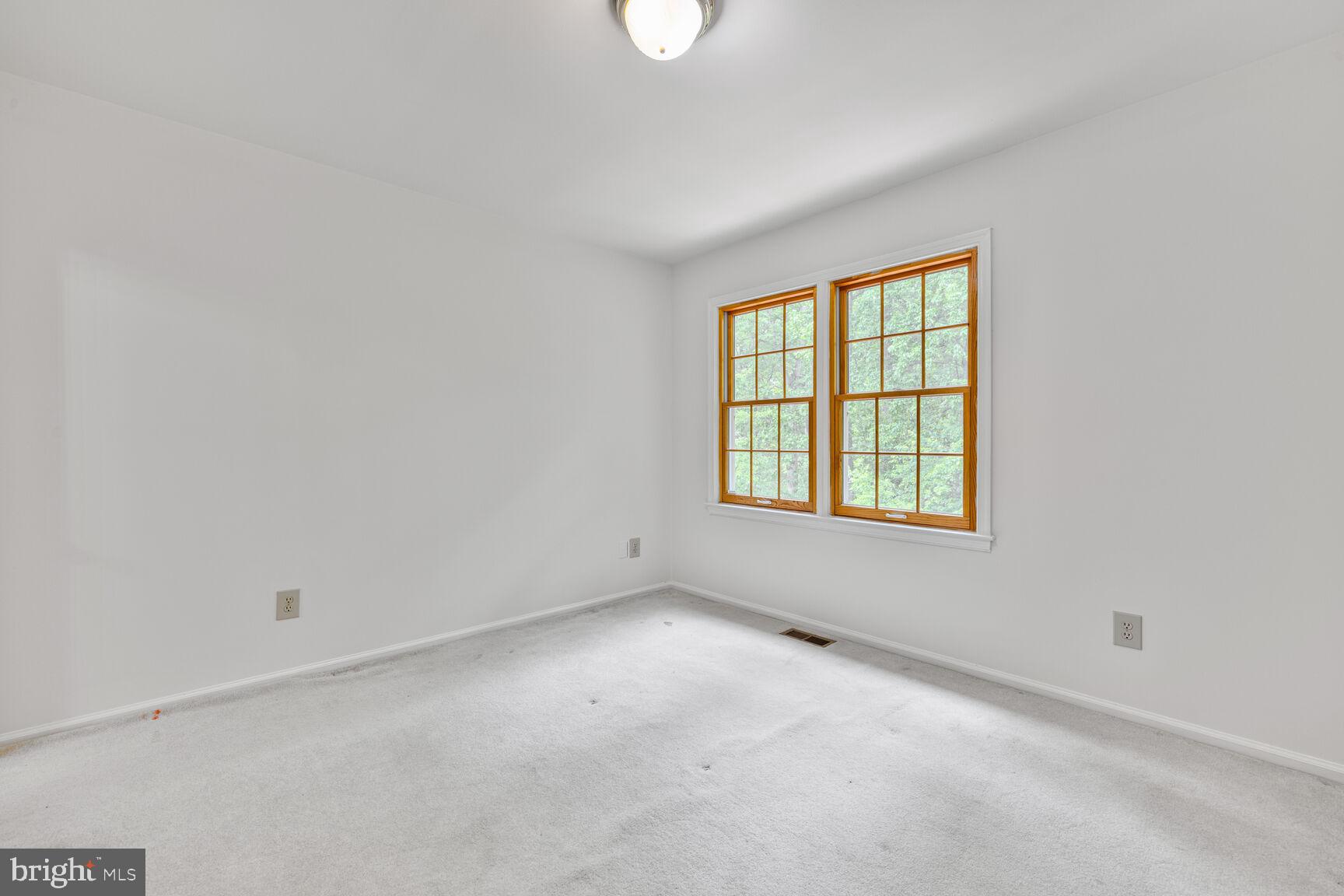 9605 Reach Road Potomac, MD 20854 - Photo 23 of 44 an empty room with windows