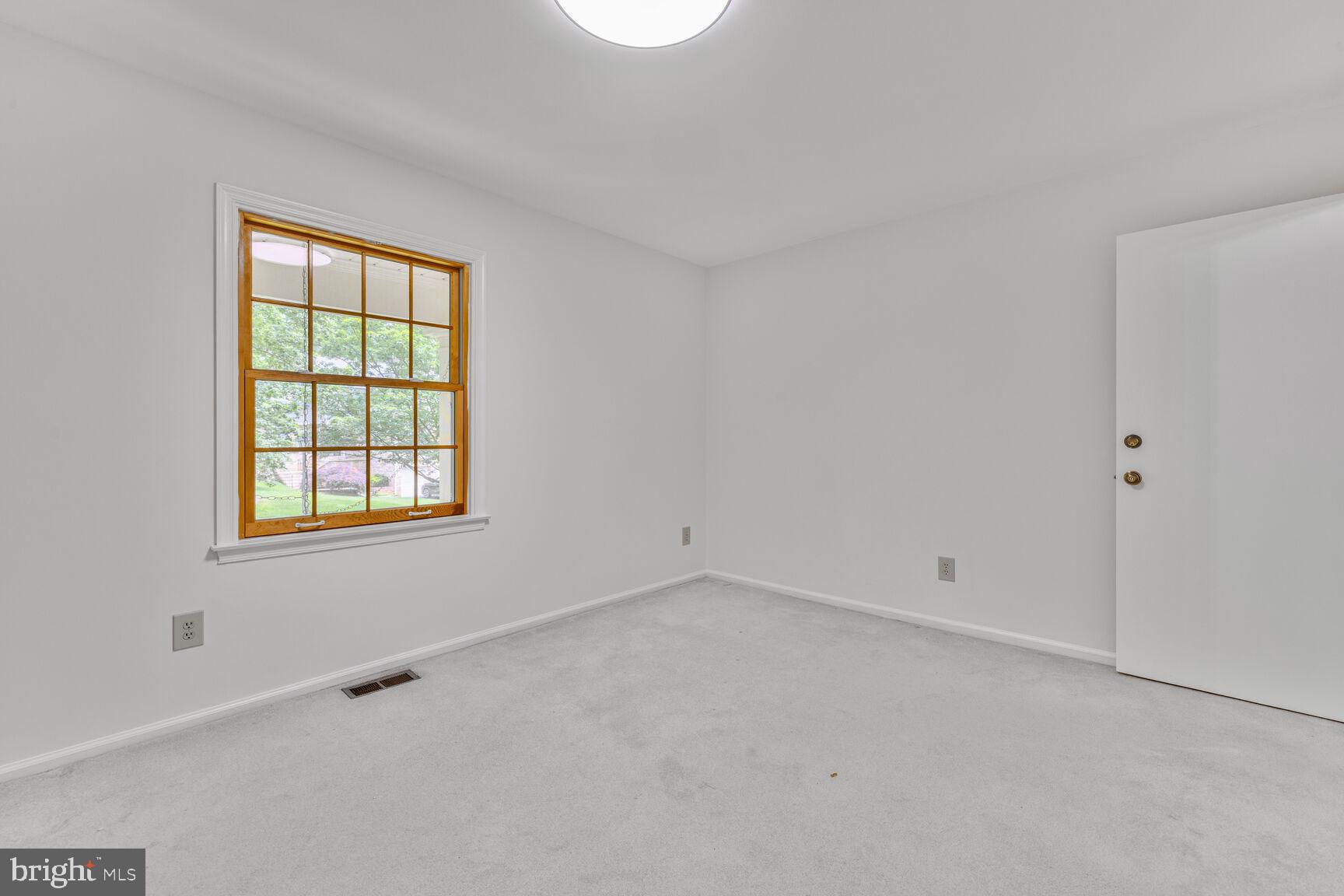 9605 Reach Road Potomac, MD 20854 - Photo 24 of 44 an empty room with a window