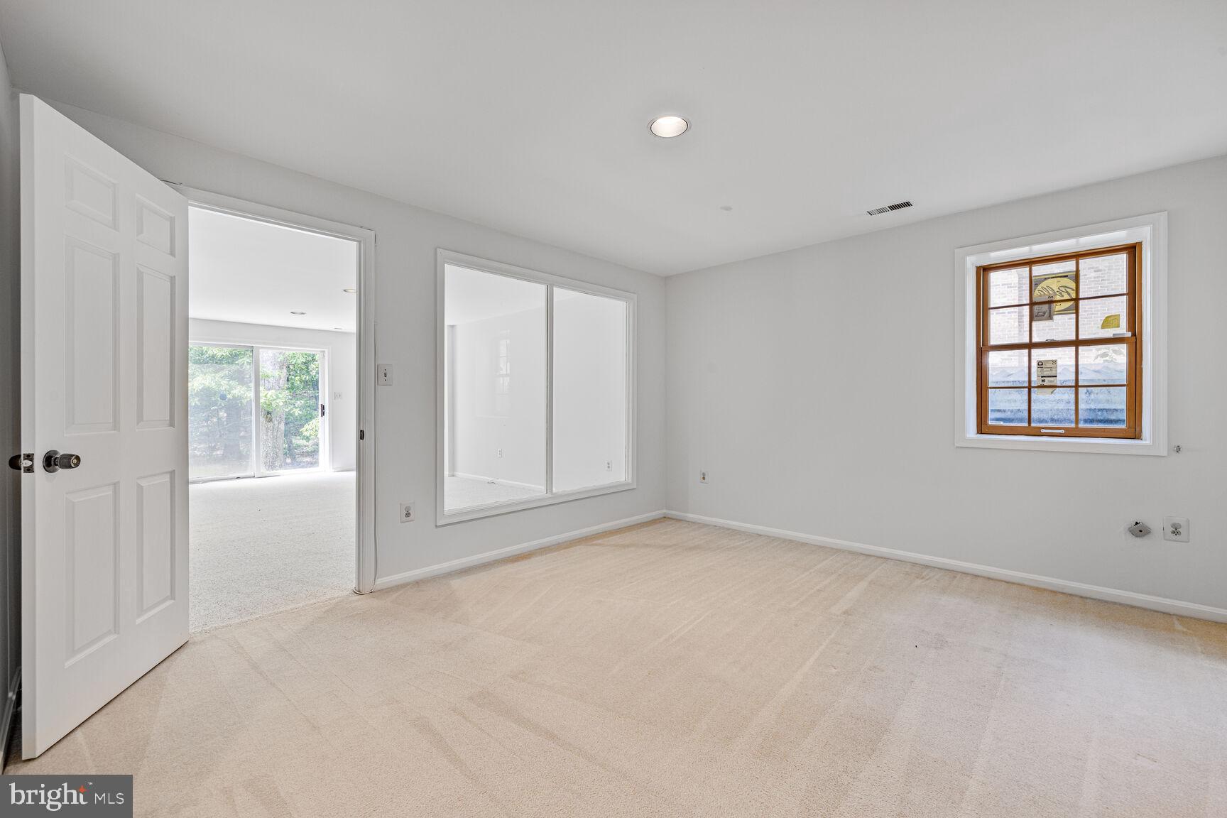 9605 Reach Road Potomac, MD 20854 - Photo 26 of 44 a view of an empty room with a window