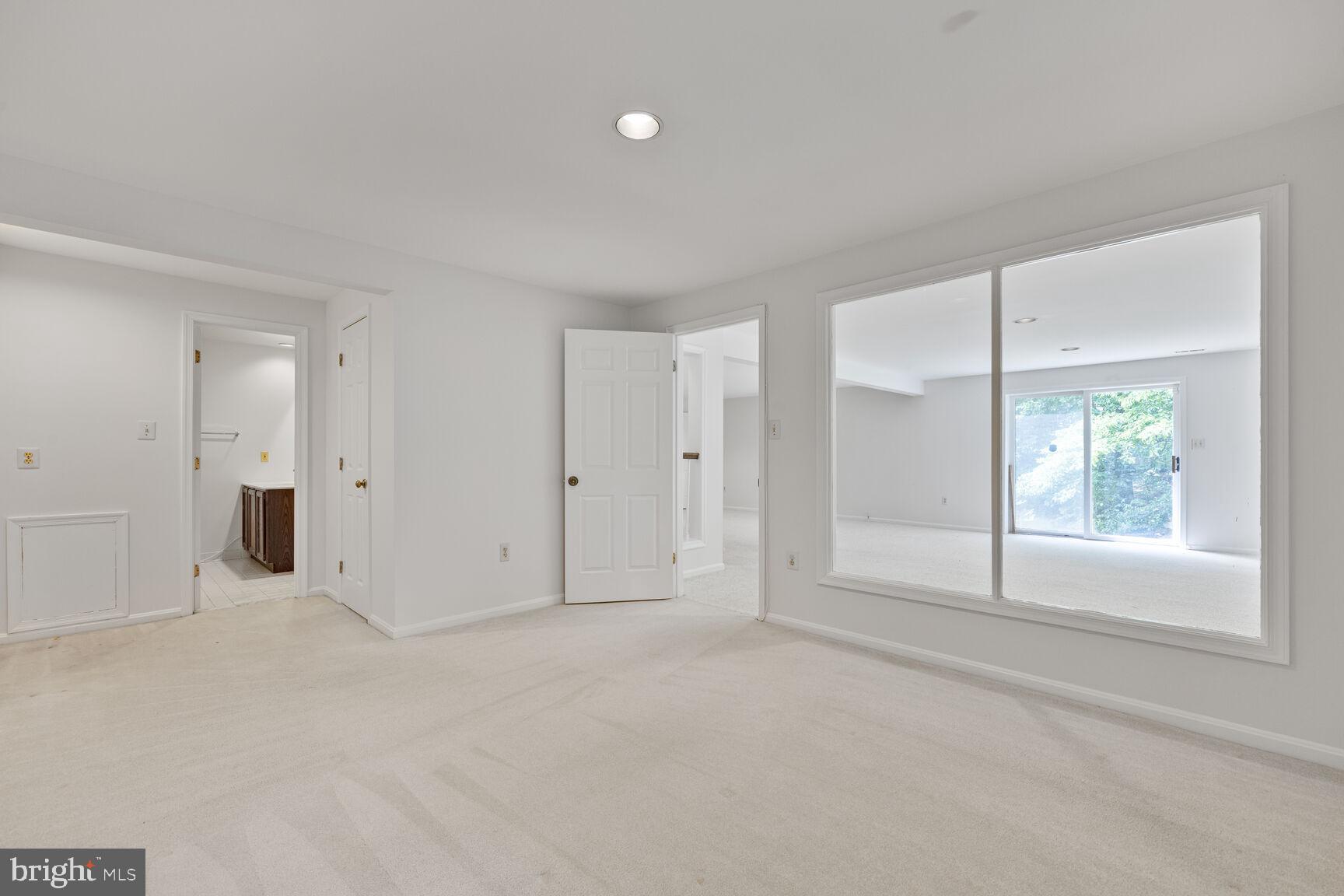 9605 Reach Road Potomac, MD 20854 - Photo 27 of 44 a view of an empty room with a window