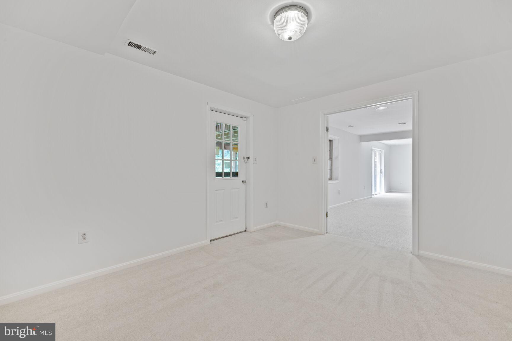 9605 Reach Road Potomac, MD 20854 - Photo 28 of 44 an empty room with windows