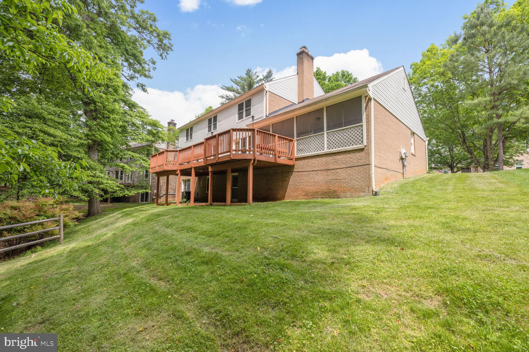 9605 Reach Road Potomac, MD 20854 - Photo 30 of 44 a view of a house with a backyard