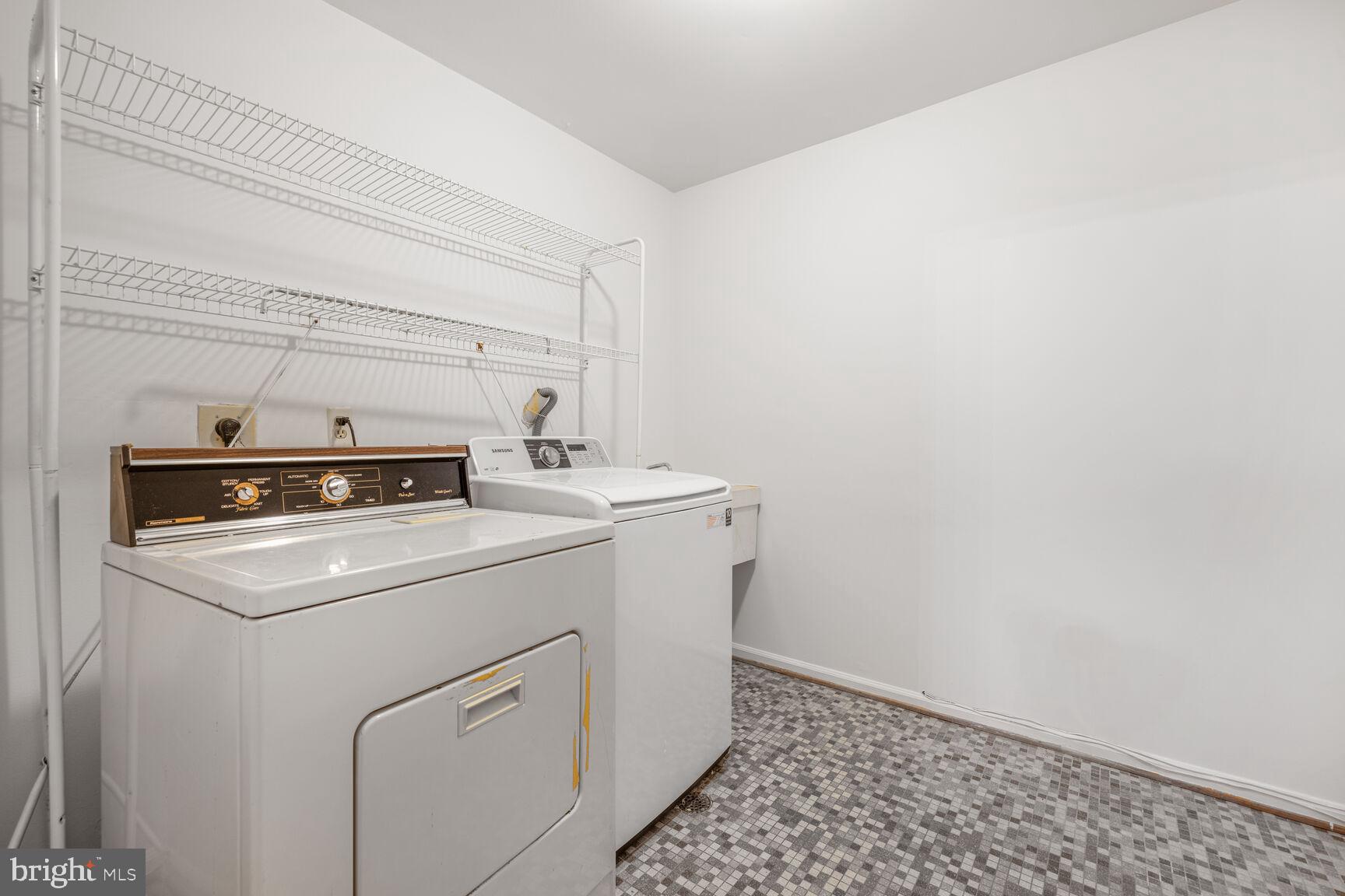 9605 Reach Road Potomac, MD 20854 - Photo 38 of 44 a utility room with dryer and washer