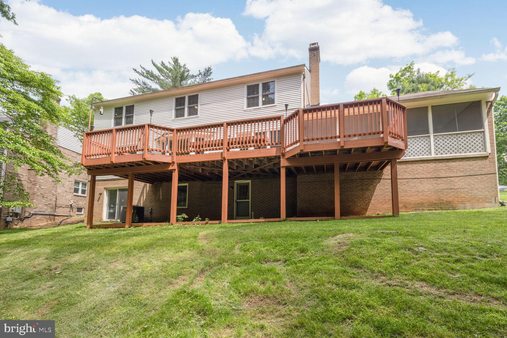 9605 Reach Road Potomac, MD 20854 - Photo 39 of 44 a view of a house with a yard and sitting area
