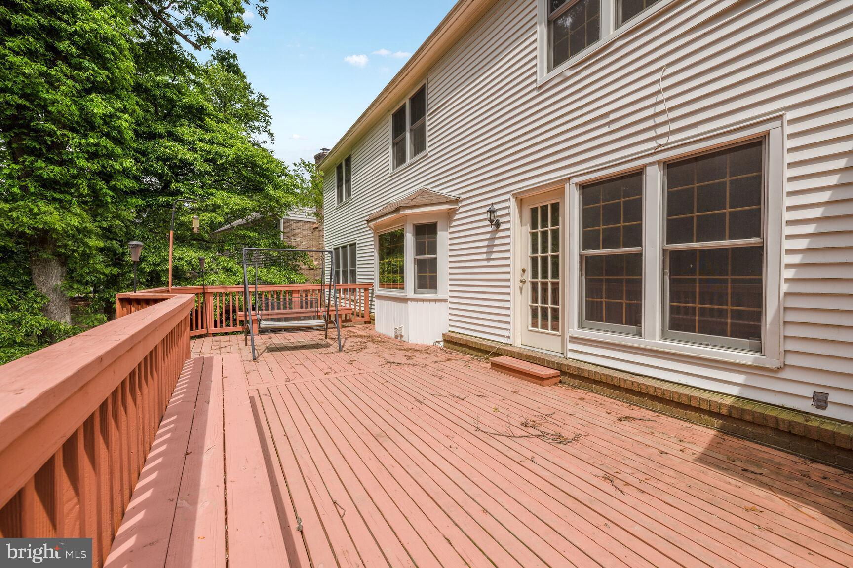 9605 Reach Road Potomac, MD 20854 - Photo 40 of 44 a view of deck with chairs and wooden floor