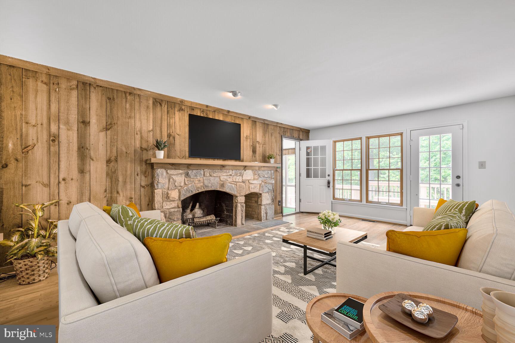 9605 Reach Road Potomac, MD 20854 - Photo 7 of 44 a living room with furniture fireplace and a flat screen tv